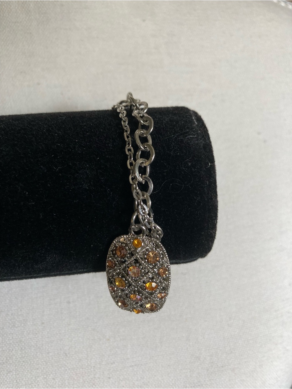 Silver-Tone Pendant Bracelet with Amber Crystal Accents